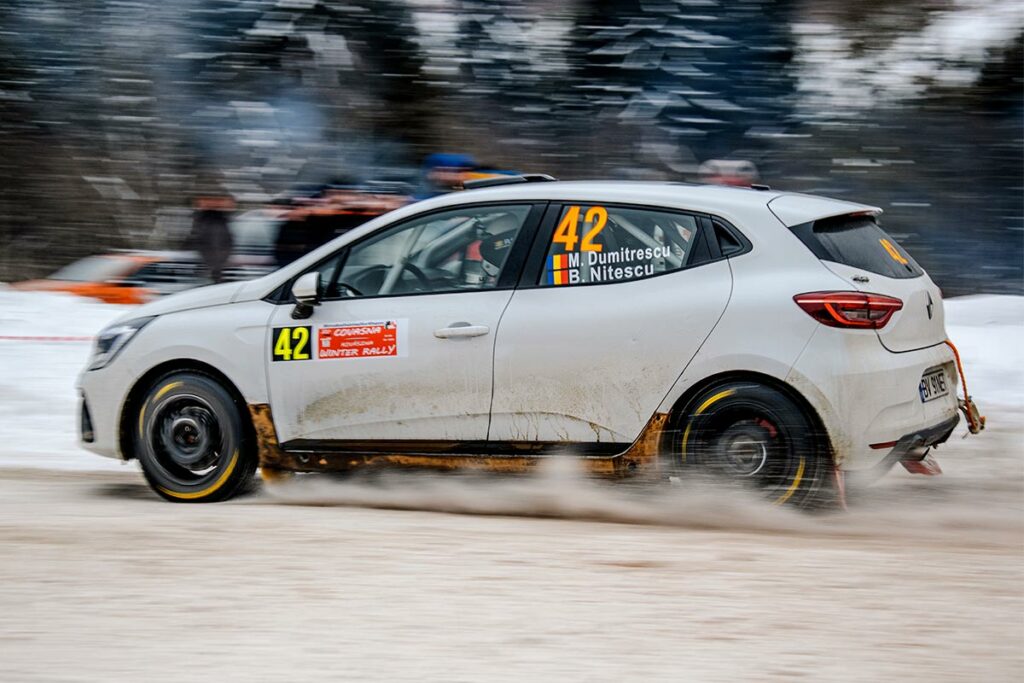 Renault car rally racing off road in winter