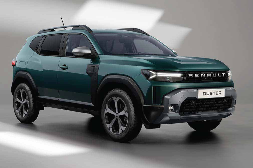 Green Renault Duster SUV shown in a studio setting, front three-quarter view highlighting the grille and headlights with a teal body color.