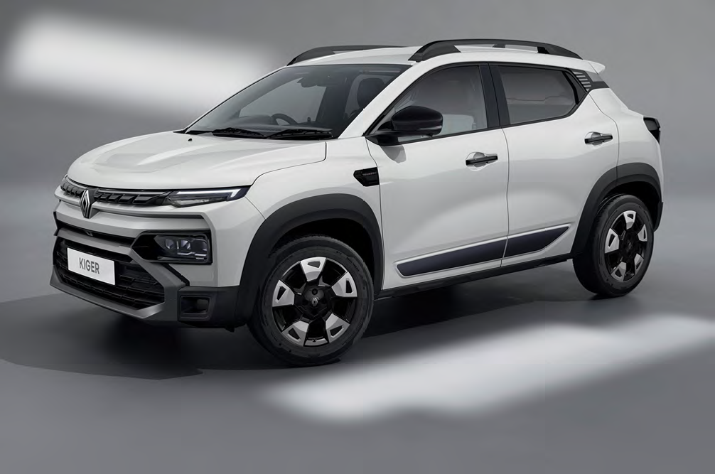 White Renault Kiger compact SUV shown from a front-left angle, with black cladding and roof rails.