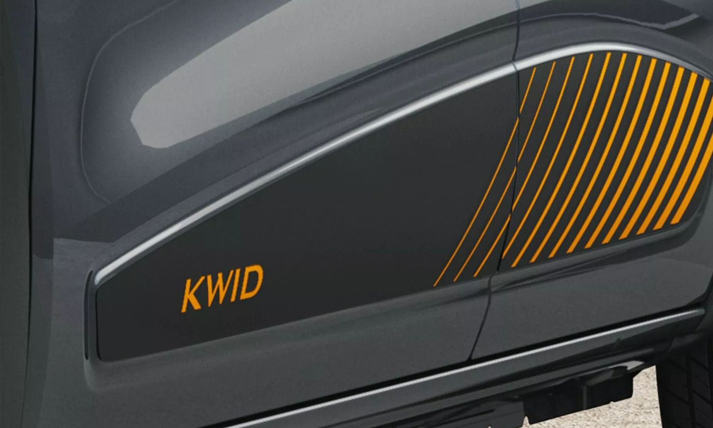 Side view of a dark car door with orange diagonal stripes and KWID badge in orange letters on the lower panel