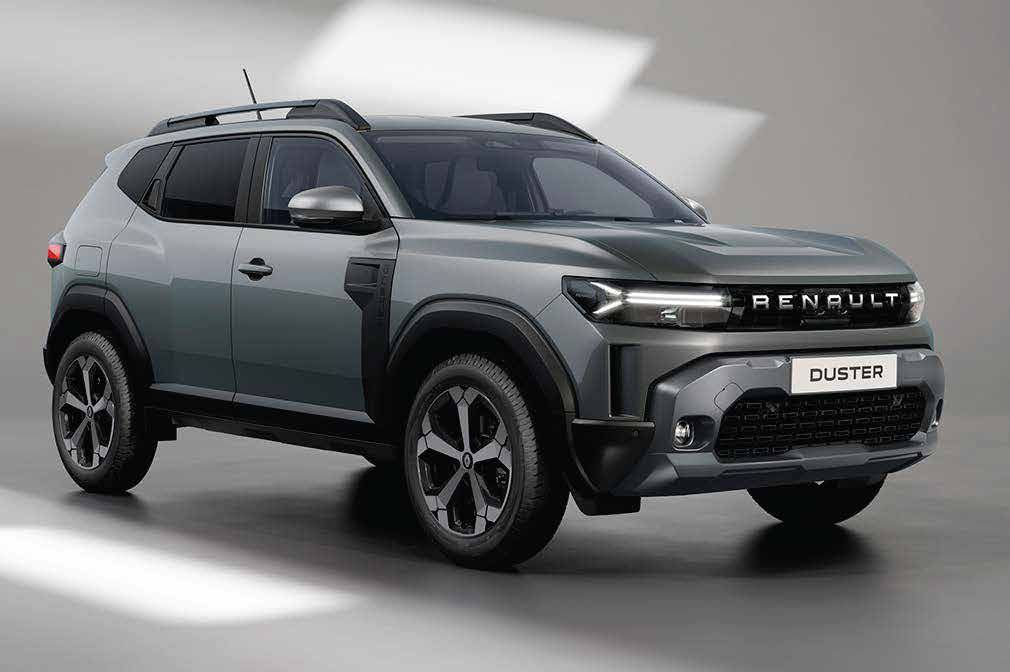 Three-quarter front view of a metallic gray Renault Duster SUV with roof rails and large alloy wheels