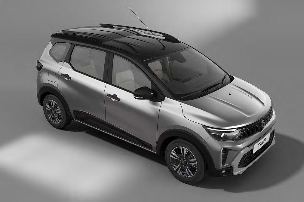 Silver compact SUV photographed from above, front-right three-quarter view with roof rails and alloy wheels in a studio-like setting.