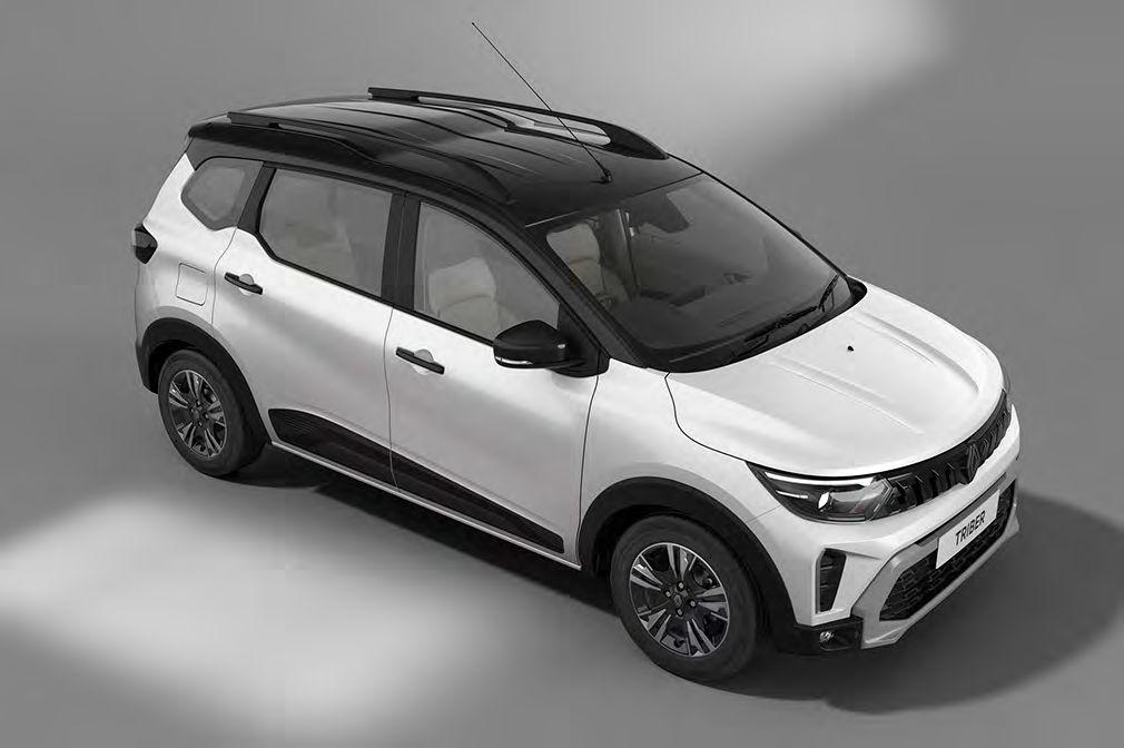 Top-down view of a white compact SUV with black roof and roof rails on a gray background, showing its angular front end and side profile.
