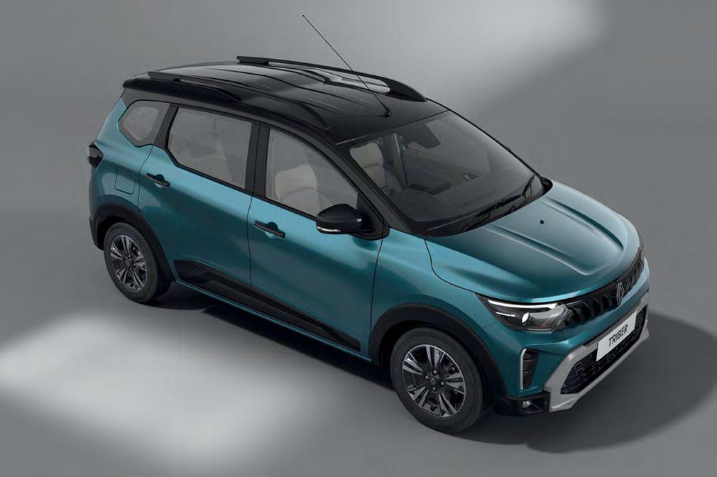 Teal-blue compact SUV photographed from a high front-right angle, showing roof rails and two-tone body.