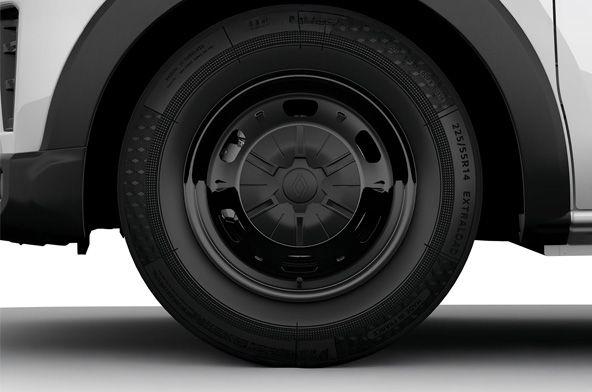Close-up of a vehicle's wheel and tire, showing a black hubcap and surrounding wheel well.